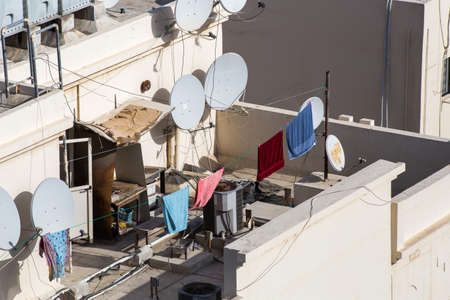 the hung clothes is dried on the roof of the house in the old Arab districtの写真素材