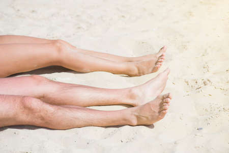 feet sunbathing on the beachの写真素材