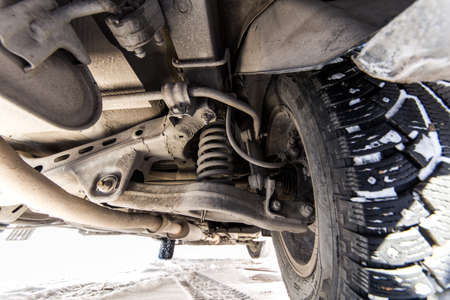Under the car. Wheels, exhaust system and suspensionの写真素材