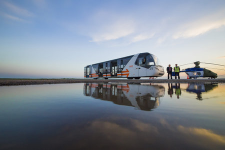 Ufa, Russia. May 19, 2018: Passenger shuttle and helicopter at the airport and people silhouettes....