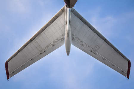 Passenger airplane, view with behind. tail of an aircraftの写真素材