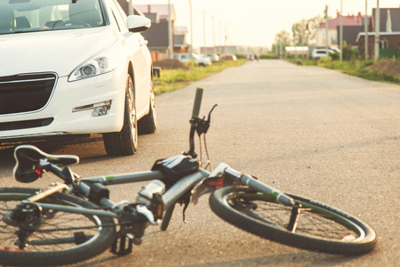 a close-up of a bicycle caught under the wheels of a car. accident on the road, accident, traffic...