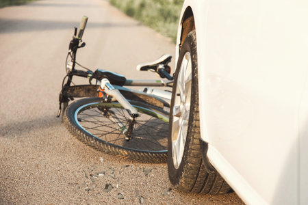 a close-up of a bicycle caught under the wheels of a car. accident on the road, accident, traffic...