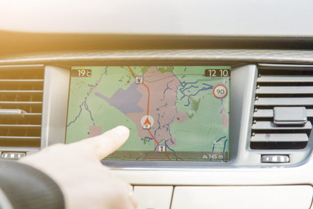 Man hand touching to screen multimedia system with application navigation