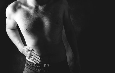 Man pressing grabbing bloated abdomen or belly as cramp flatulence constipation problem, stomach...