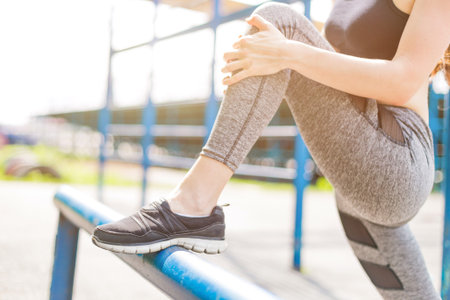 beautiful girl in sports uniform, doing exercises on the street, running around, drinking water....