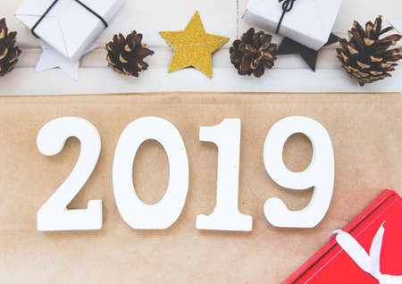 New Years and Christmas layout 2019. festive decorations, cones, garlands, gifts, figures 2019, xmas flatlayの写真素材