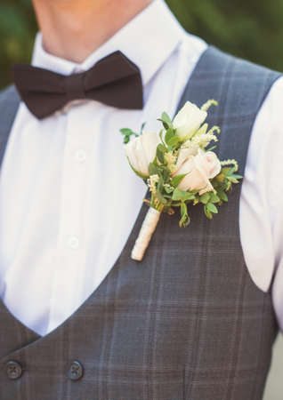 Beautiful boutonniere of the groom. Design a boutonniere. Wedding day.の写真素材