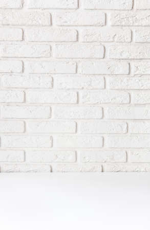 White brick wall and table, background for subject shooting. mock upの写真素材