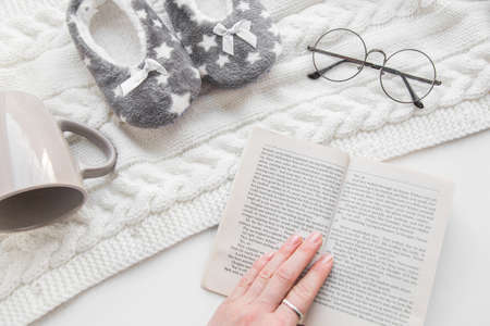 Female hand is holding a book.の写真素材