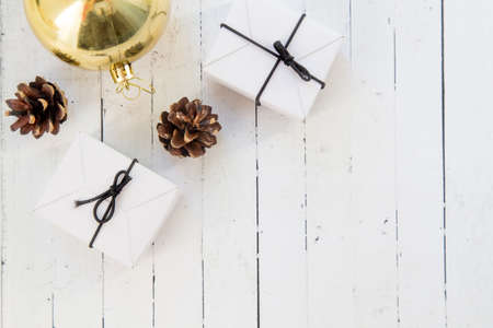 New Years layout 2019. Free space for text. Christmas decorations, Christmas toys, cones, boxes with gifts. Old wooden white backgroundの写真素材