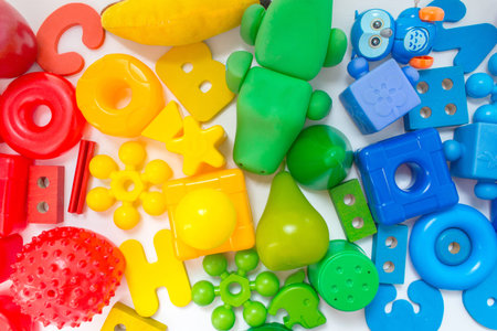 Many colorful Kids toys frame on white background. Top view. Flat lay.の写真素材
