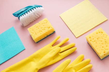 Flat lay Detergents and cleaning accessories in pink color. Cleaning service concept. Flatlay, Top viewの写真素材