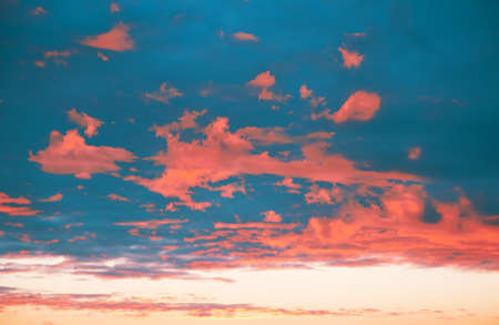 tower on the horizon against the background of the setting sun in the color of the year 2019 living Coralの写真素材