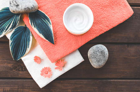 composition top view of bathroom and spa beauty room. Moisturizing and skin care, flowers, cream and natural ingredients, free place . Color of the year 2019 Living coral . COY Livingcoral.の写真素材