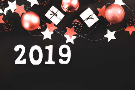 Happy New Year's layout. numbers 2019 notepad and free space for text. Christmas decorations , Color of the year 2019 living coral. livingcoralの写真素材