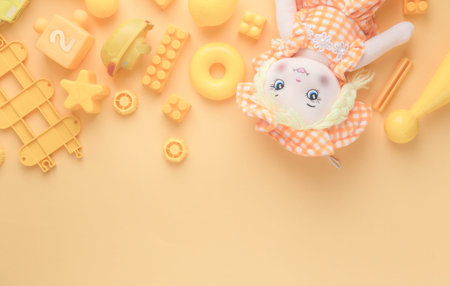 Kids toys frame on yellow backround. Top view. Flatlay. Copy space for text