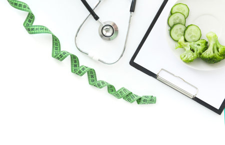 doctor nutritionist table. Healthy and healthy food, broccoli, pickers and avacado. Stethoscope and diet pills. Top View and flatlay, free space for text.の写真素材