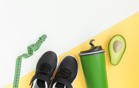 healthy lifestyle and fitness in sports, morning jogging. Sneakers, avocados, headphones and a water...