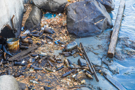 trash plastic bottles on the beach. oil and water pollution of the oceanの写真素材