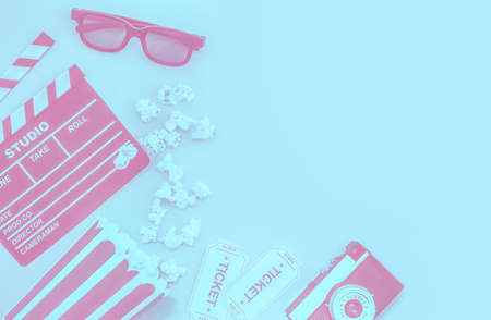 Cinema party concept. movie tickets, clapperboard, pop corn and 3d glasses in a pastelの写真素材