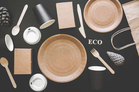 Eco friendly disposable dishes made paper on blackの写真素材