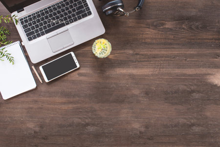 Top view of hipster wooden workspace, office table desk