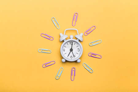 Alarm clock on yellow trendingの写真素材