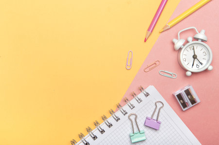 Colorful stationary school supplies on yellow trending