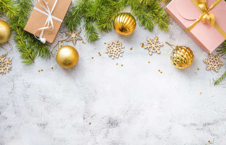 New Year's flatlay composition top view. Gift box with a bow, Christmas tree branches and free space, mock up.の写真素材