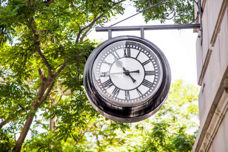 Vintage style street clock view close up.の写真素材