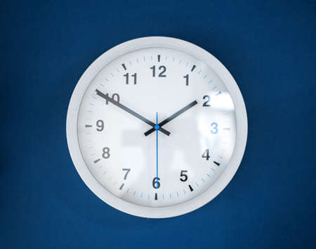 white clock on a classic blue color wall.の写真素材