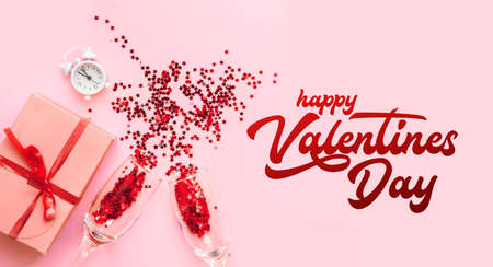 Valentines day background with champagne glasses and gift.の写真素材