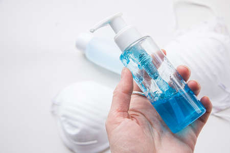 Coronavirus covid-19 prevention medical surgical masks and hand sanitizer gel for hand hygiene corona virus protection.の写真素材