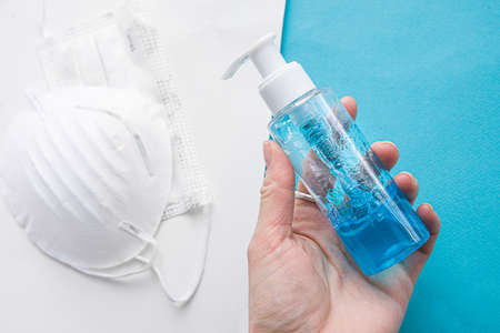 Coronavirus covid-19 prevention medical surgical masks and hand sanitizer gel for hand hygiene corona virus protection.の写真素材