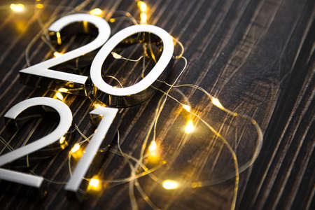 metal figures 2021 with a garland on a ninth background. new years eve.の写真素材