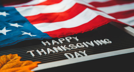 FLatlay composition happy thanksgiving day . american flag, pumpkins and autumn leaves on a black...
