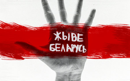 hand and Belarusian flag. protests in Belarus after the presidential elections. The inscription on...