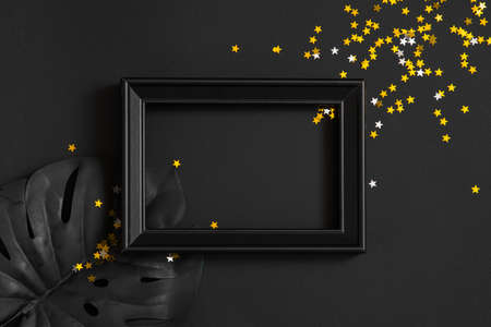 new year and christmas black background and gold decorations. background for text in a frame for a partyの写真素材