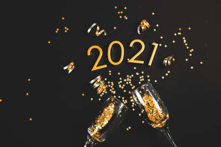 a bottle of champagne, Figures 2021. Christmas or New Year background, plain composition made of Xmas decorations and fir branches, flat lay, blank space for a greeting text.の写真素材