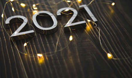 metal figures 2021 with a garland on a ninth background. new years eve.の写真素材