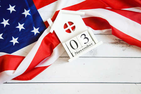november 3 2020, 59th presidential election in USA. Flat lay composition: United states flag on white wood background.の写真素材