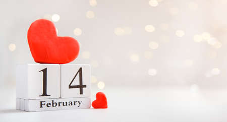 Wooden calendar show of February 14 with red heartの写真素材