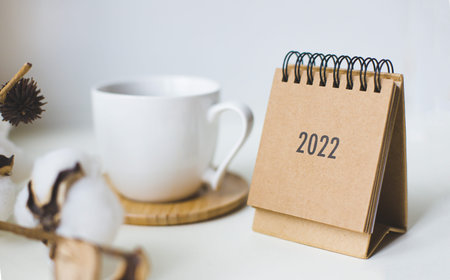 Close up calendar on table with coffe cup.