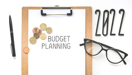 Budget and financial plan 2022. Money, coins on tableの写真素材