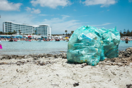 garbage bags on the beach. Environmental pollution. Ecological problem.の写真素材