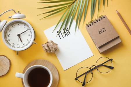 plan for 2022. Calendar and office accessories on the table top view.の写真素材
