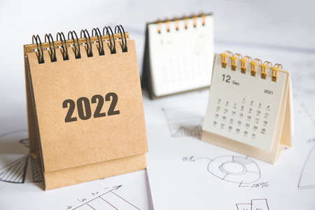 2022 Calendar and business charts on the table top view. planning and setting goals for the next yearの写真素材