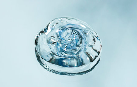Drop Serum texture. Clear liquid cream gel round drop with bubbles.