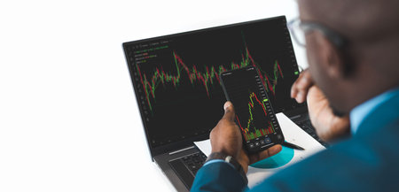 african Businessman Investment Entrepreneur Trading working on Laptop Stock market exchange...